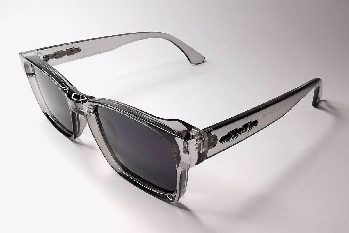 Clear frame sunglasses with dark lenses on a white background