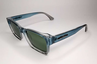 Blue sunglasses with a clear frame on a white background