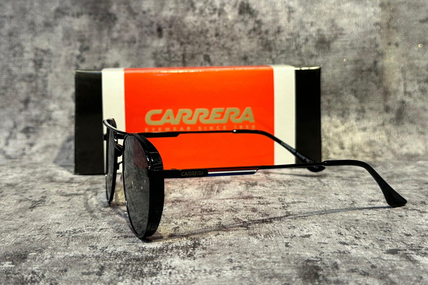 Carrera toy car trailer on a gray concrete surface