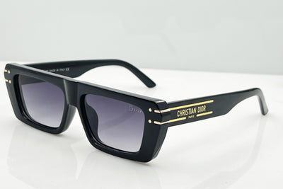Black Christian Dior sunglasses with gold accents on a white background